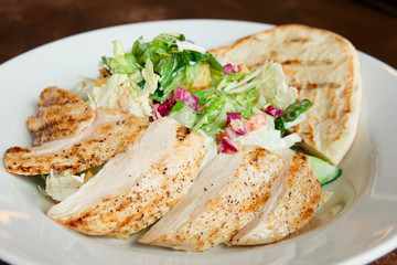 Grilled chicken fillet and Greek pita