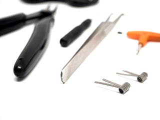 Vaping accessories and tools in a white background