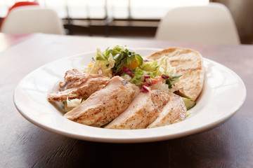 Grilled chicken breast and Greek pita