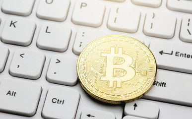 Bitcoin on computer keyboard