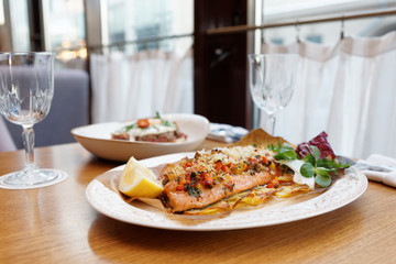 Grilled fish with vegetables and another food