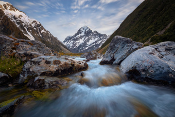 Dramatic sky over river Mount Cook in New Zealand