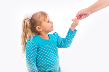 Human hand giving child medicine healthcare pill