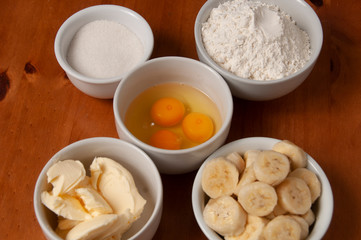 Fototapeta na wymiar Cake Ingredients - Banana, Eggs, Wheat Flour, Butter, Margarine, Milk