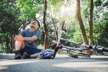 Boy injury hurts from falling bike, hurt on his arms, pain ache from workout concept