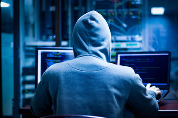 Hackers often work in low-light rooms to cover their faces. And obscure action.