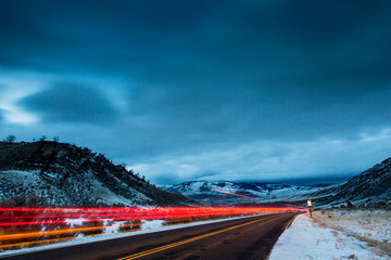 YELLOWSTONE, USA Light trails of a car after last light. © Dave
