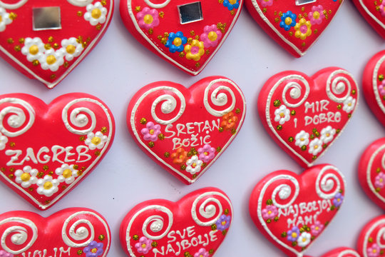 Advent in Zagreb, Croatia. A vendor selling hand made Christmas decorations with traditional Licitar heart symbol of Zagreb
