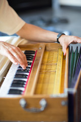 a man plays on a musical instrument. emphasis on hands