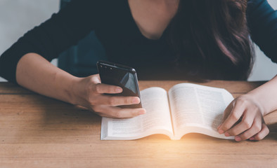 Businesswoman are check out the graph and reviewing data of company profits are in the workplace filled with documents for cooperation and partner concept.