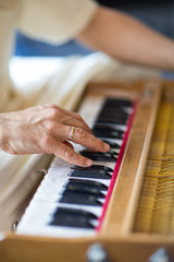 Fototapeta premium a man plays on a musical instrument. emphasis on hands