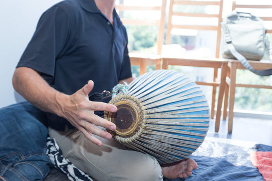 a man plays on a musical instrument. emphasis on hands