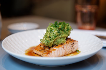 Salmon steak with guacamole