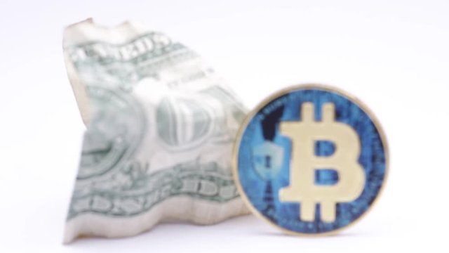 blurred crumpled dollar money and   bitcoin