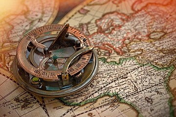 old map and compass , navigation and geography 