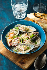 Mussels with Blue Cheese Sauce and Garlic Baguette.