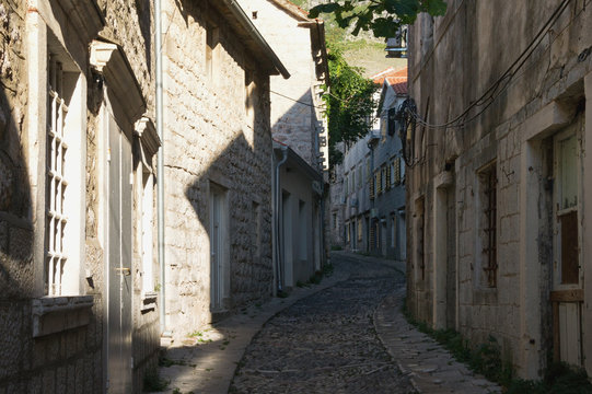 Old narrow winding street. Montenegro, view of Gabela street in Risan town, this is one of the oldest cobblestone roads in Europe