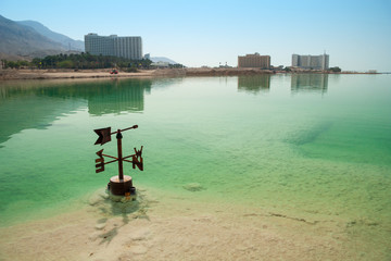 Dead Sea water level on the shore. Israel. Level indicator on the left