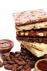 Chocolate bars on table with chocolate tower.