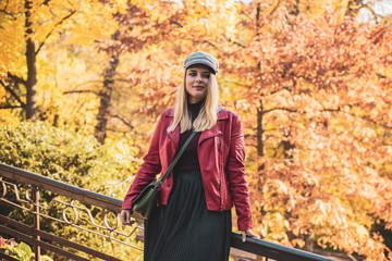 A woman of plus size, American or European appearance walks at park enjoying life. Nice beautiful lady with excess weight, rest at city park 