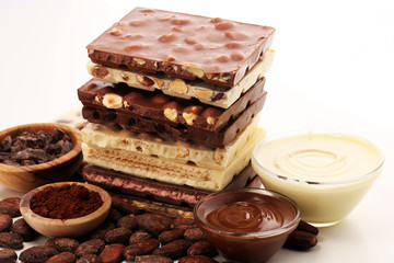 Chocolate bars on table with chocolate tower.