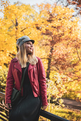 A woman of plus size, American or European appearance walks at park enjoying life. Nice beautiful lady with excess weight, rest at city park 