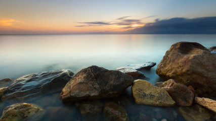 Fototapeta na wymiar Calm sea at sunset.