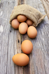 Fresh egg roll down on wooden table. Food ingredient.