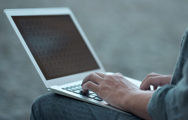 Student typing on the keyboard.