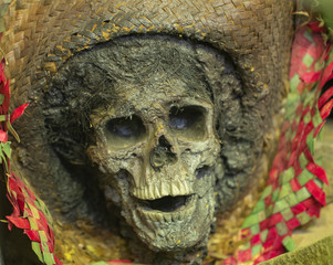 skeleton wearing a sombrero is decomposing