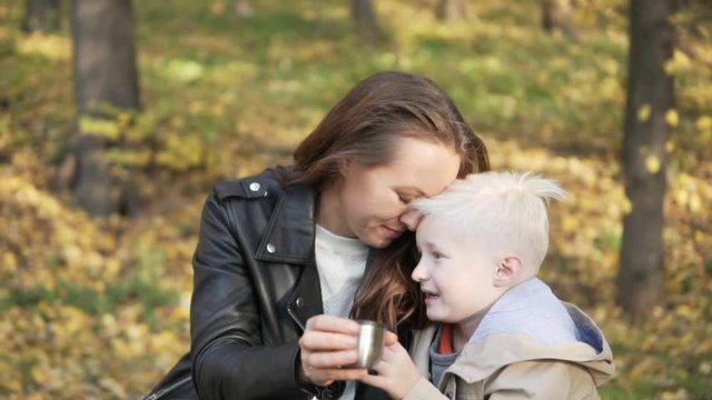 A touching and sweet video of tenderness of mom and son. they touch each other with their noses and smile. Boy loves his mom