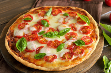 Pizza Margherita on a cutting board