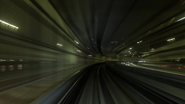Time Lapse of train moving through city at night, internet connectivity