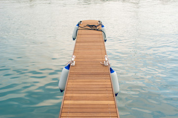 Obraz premium Wooden pier with buoys