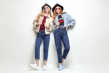 Two Girls Fooling Around. Fashion Autumn Outfit