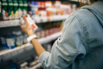 Young woman shopping in food store
