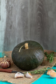 Green Pumpkin and ingredients for tasty vegetarian cooking
