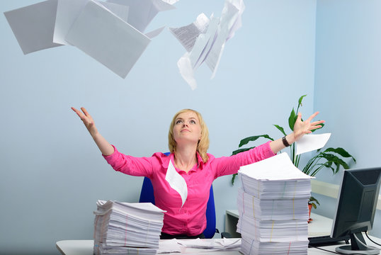 The girl at office throws a paper