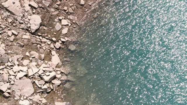 droneflight over a swiss mountain reservoir