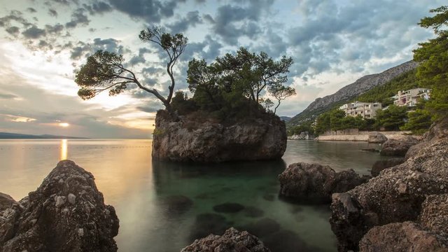 Time Lapse of sea with rock formations during sunset, Brela, Croatia
