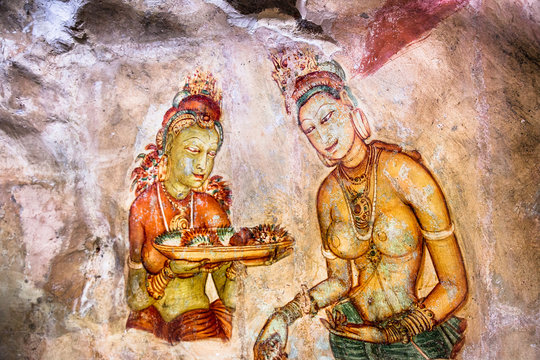 Tweo girls on the wall of Sigiriya , Sri Lanka.