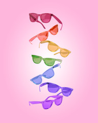 
Creative concept of a group of multi-colored glasses. 3D illustration
