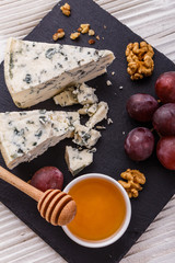 delicious blue cheese on wooden rustic background