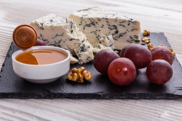 delicious blue cheese on wooden rustic background