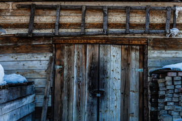 Dark wooden texture background. Old wooden door in winter