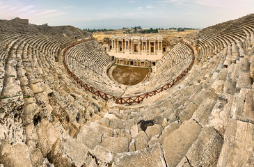 Ancient amphitheater, Hierapolis - an ancient city located on the slope of the Cökelez mountain,...