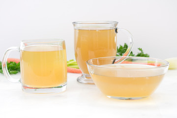 Chicken Stock in Glass Mugs and Bowl