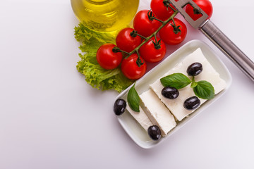 A piece of feta cheese on a white background