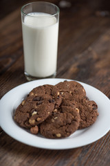 Chocolate cherry cookies and a glass of milk