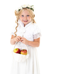 Little girl with a basket of apples.